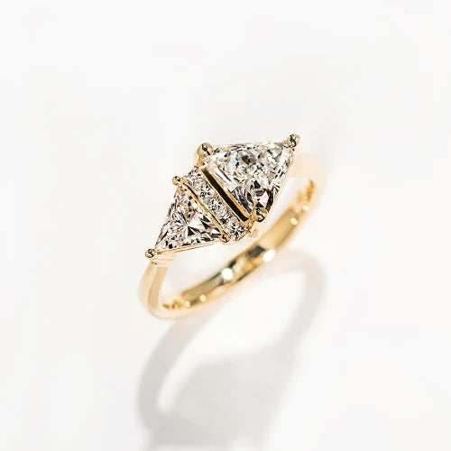 custom two stone yellow gold ring with diamond accents