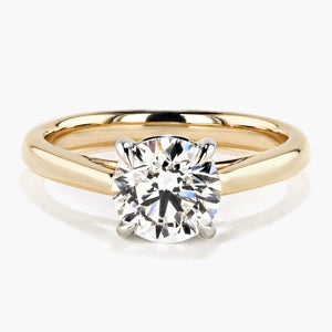 cathedral solitaire engagement ring with round cut lab grown diamond center stone set in 14k yellow gold recycled metal by MiaDonna