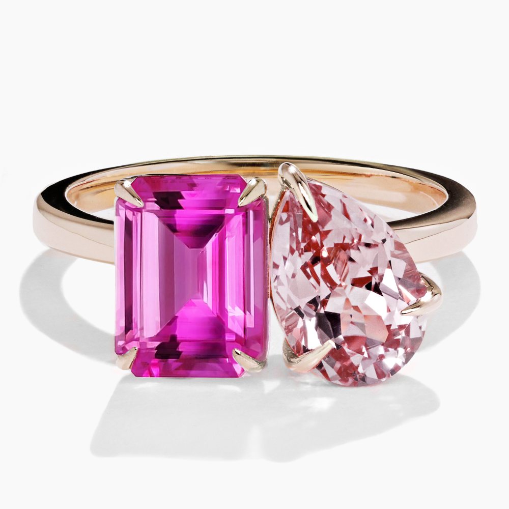 Shown in 14K Yellow Gold with an Emerald Cut Lab Created Pink Sapphire and a Pear Cut Lab Created Pink Champagne Sapphire