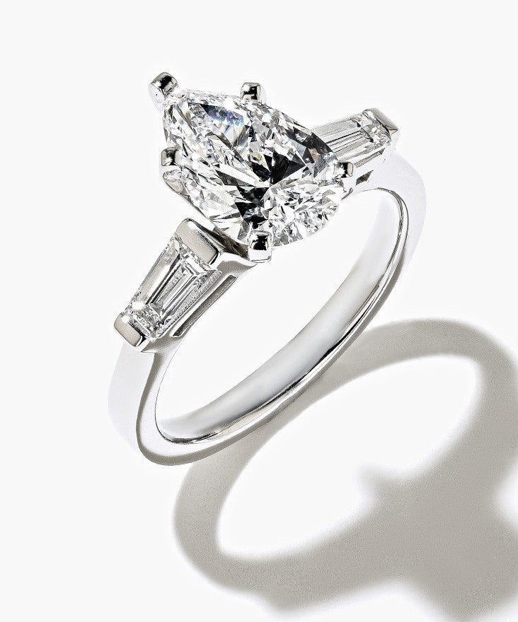 Three Stone Diamond Ring, set with a Pear Cut Diamond and baguette-cut side lab-grown diamonds.