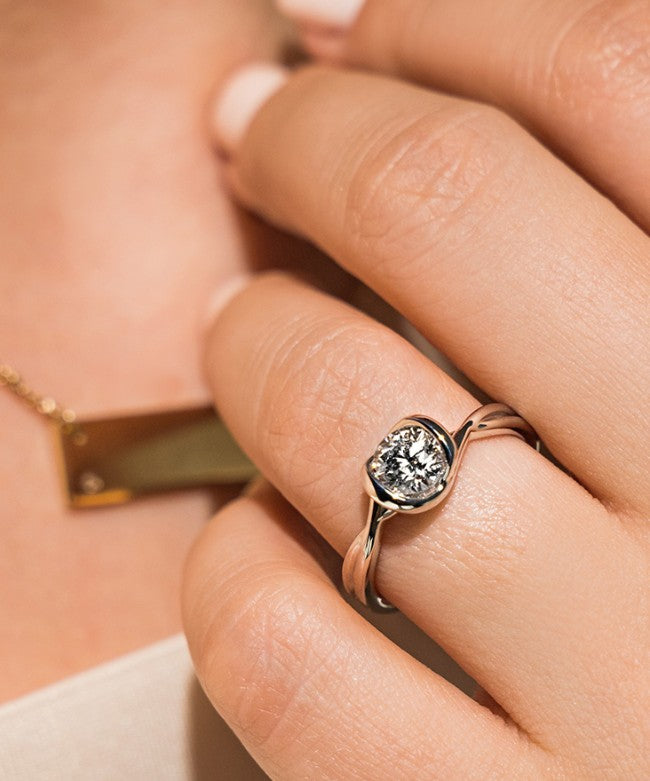 Modern lab grown diamond engagement ring.