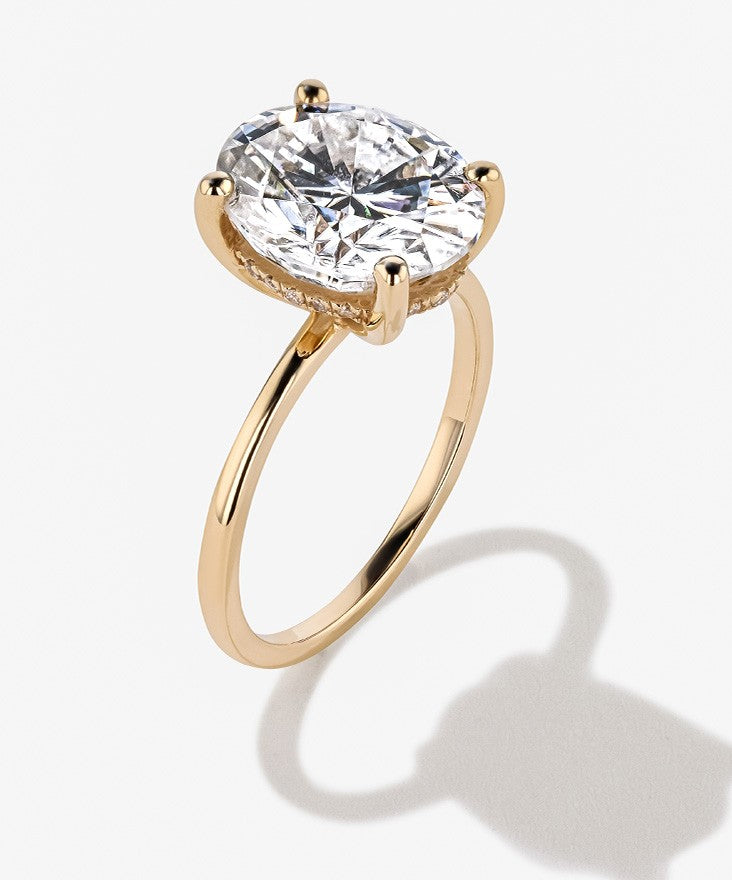 Sustainable Oval Diamond Ring with a Hidden Halo set Yellow Gold
