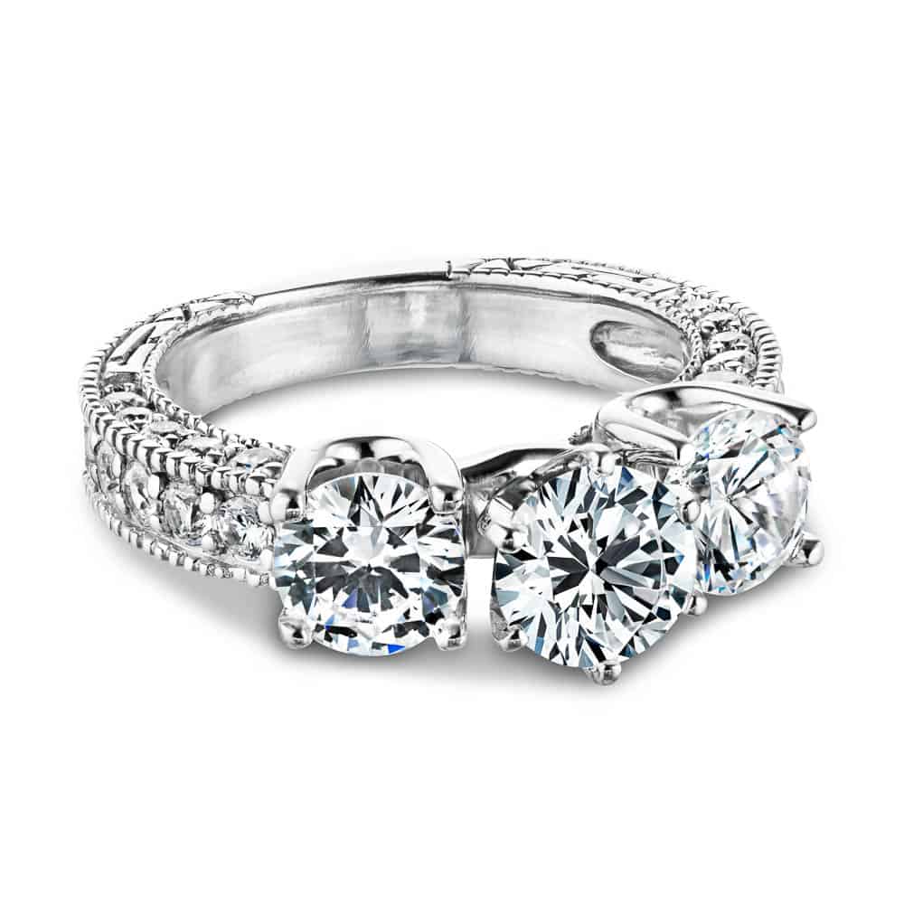 Shown with three Round cut Lab-Grown Diamonds and filigree detailing and accenting diamonds on the band in recycled 14K white gold | vintage three stone engagement ring Shown with three Round cut Lab-Grown Diamonds and filigree detailing and accenting diamonds on the band in recycled 14K white gold