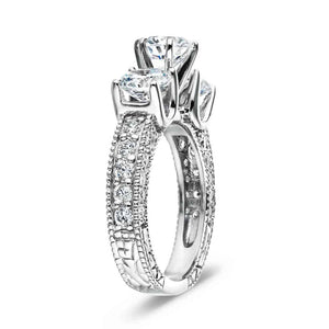  vintage three stone engagement ring Shown with three Round cut Lab-Grown Diamonds and filigree detailing and accenting diamonds on the band in recycled 14K white gold