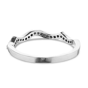 Wavy white gold accented wedding ring shown from back