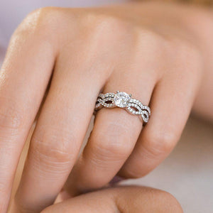 Wavy diamond accented wedding band and engagement ring with lab grown diamonds in 14k white gold worn stacked on hand