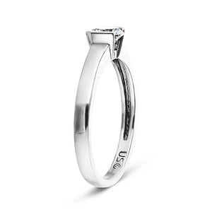 Minimalistic modern solitaire engagement ring with 1ct round cut lab grown diamond in 14k white gold shown from side