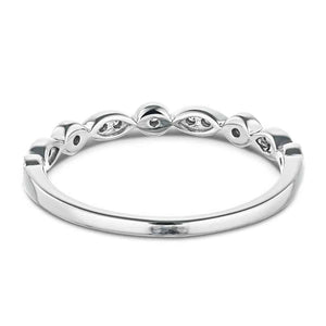 Vintage style diamond accented wedding band in 14k white gold shown from behind
