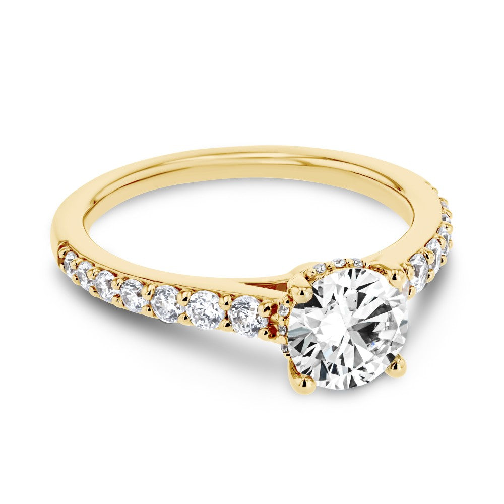 Shown here with a 1.0ct Round Cut Lab Grown Diamond center stone in 14K Yellow Gold|diamond accented hidden halo engagement ring with lab grown diamond center stone set in 14k yellow gold recycled metal