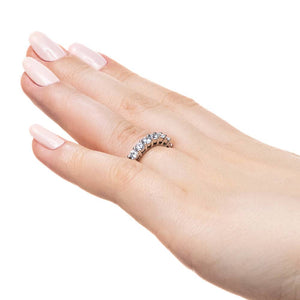 Diamond accented anniversary band in 14k white gold shown worn on hand sideview