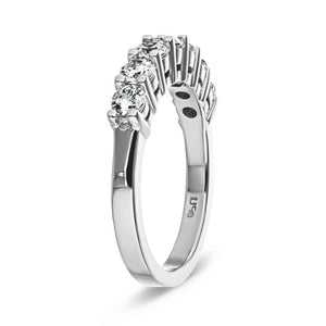 Conflict free diamond accented anniversary band in 14k white gold shown from side