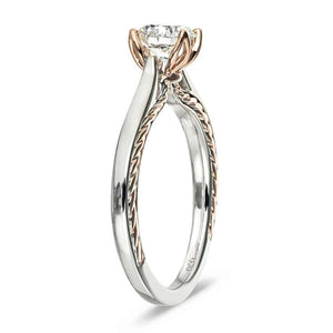 Unique two tone solitaire engagement ring with inlay braided rope design set with 1ct round cut lab grown diamond in 14k white gold and rose gold shown from side