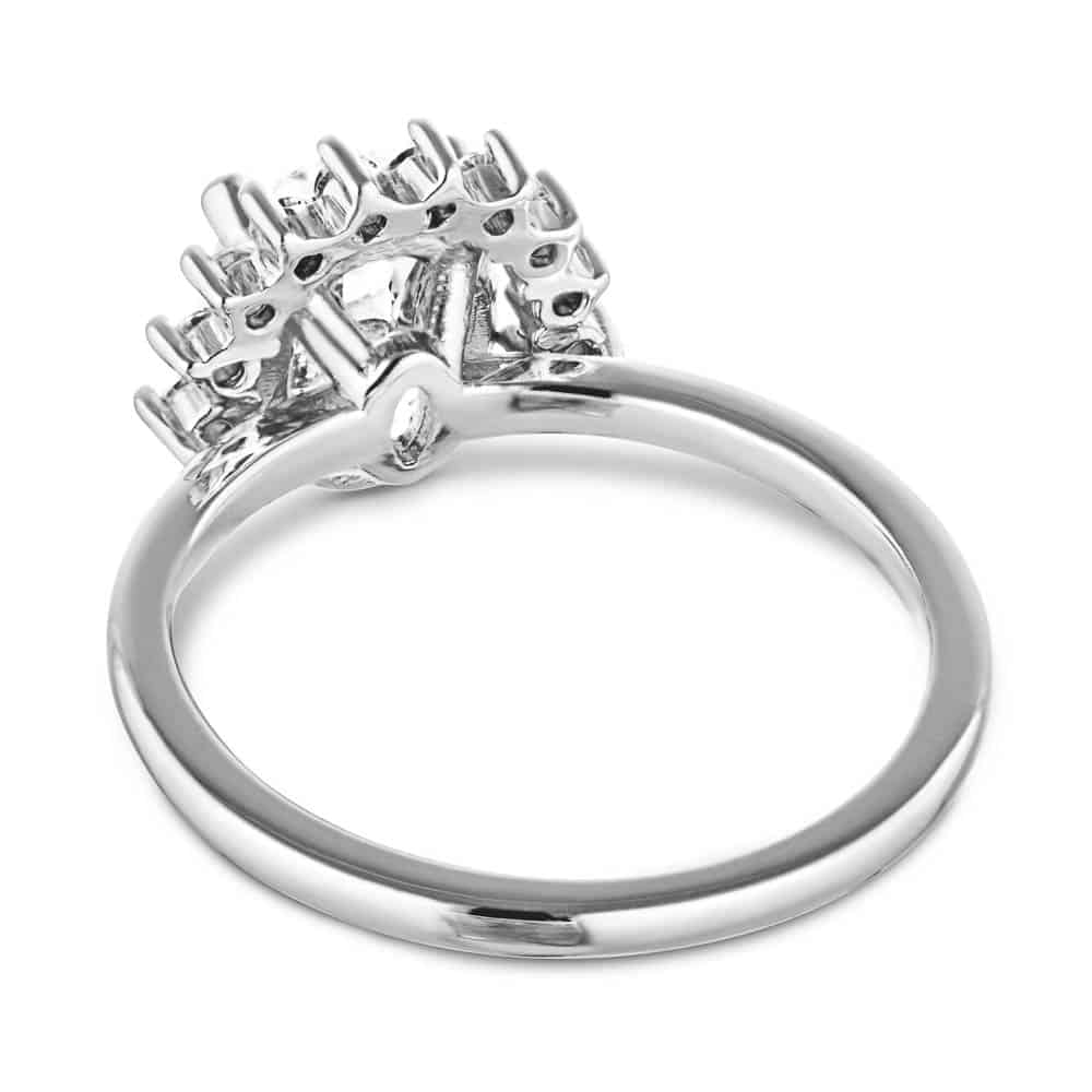 The Camilla Ring is shown here with a 1.40ct Oval cut Lab-Grown Diamond with a half diamond halo in recycled 14K white gold 