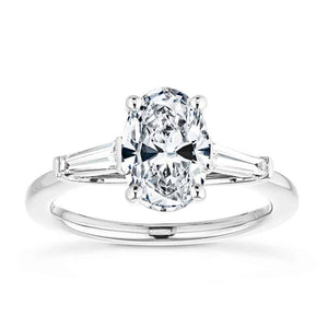 Beautiful three stone engagement ring with trellis set 2ct oval cut lab grown diamond amid baguette side stones in 14k white gold