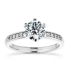 Accented engagement ring with channel set diamonds in the band and a 1ct round cut lab grown diamond center stone in 14k white gold
