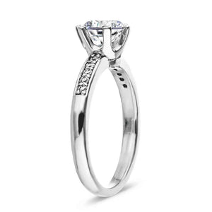 Channel set diamond accented engagement ring with 1ct round cut lab grown diamond in 14k white gold shown from side