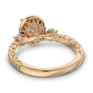 Gorgeous vintage style filigree engagement ring with accenting diamonds and hand crafted details in 14k rose gold