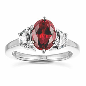 Three stone gemstone engagement ring with 1ct oval cut lab created ruby and half moon cut diamond simulant side stones in 14k white gold