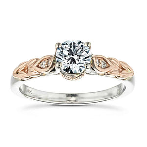 Vintage style two tone engagement ring with nature inspired designs holding a 1ct round cut lab diamond in 14k rose and white gold