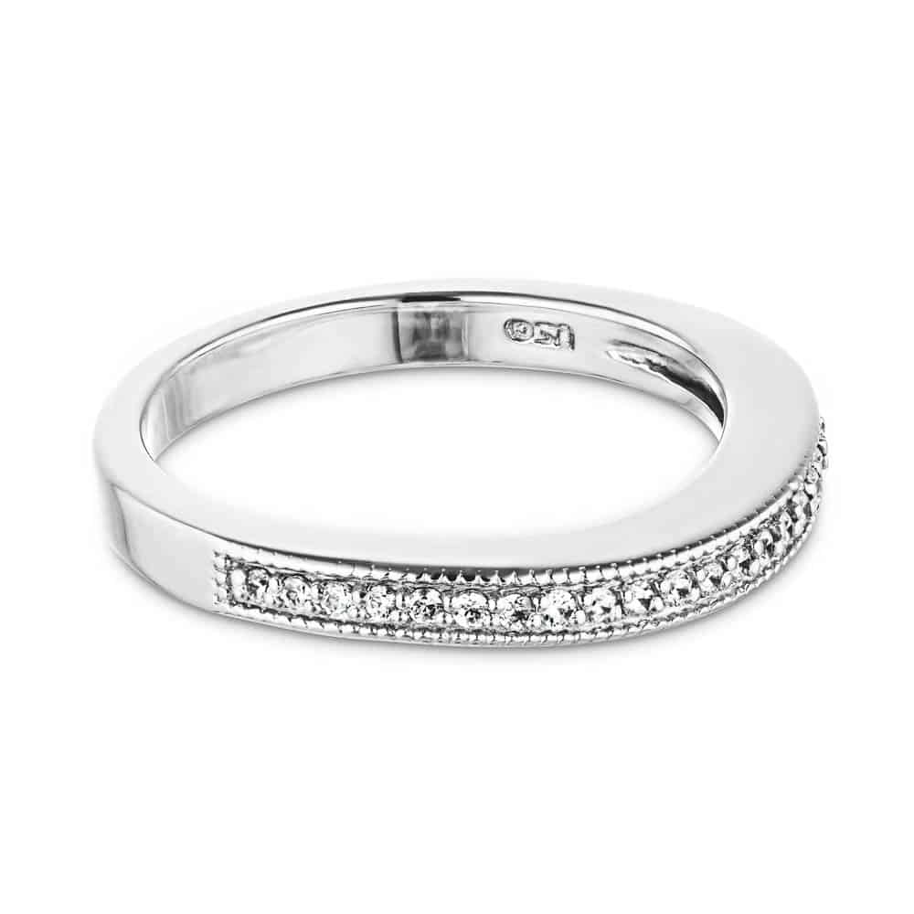 The Charisma wedding band features .21ctw recycled diamonds with milgrain edges in recycled 14K white gold 