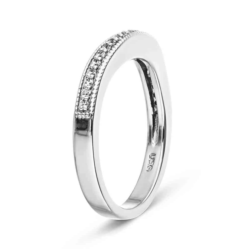 The Charisma wedding band features .21ctw recycled diamonds with milgrain edges in recycled 14K white gold 