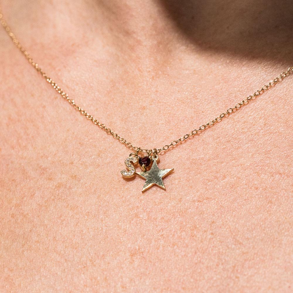 Charm Necklace feat: Accented &quot;S&quot;, Star Charm , &amp; Garnet Birthstone in 14K yellow gold 