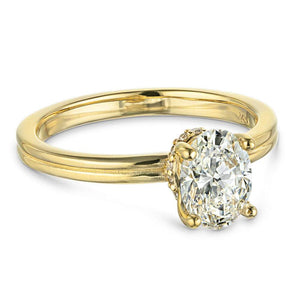 Beautiful hidden halo engagement ring with 1.5ct oval cut lab grown diamond in 14k yellow gold