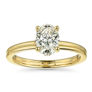 Ethical hidden halo engagement ring with 1.5ct oval cut lab grown diamond in 14k yellow gold
