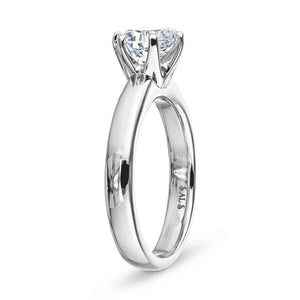 Simple solitaire engagement ring with 6 prong head set 1.5ct round cut lab grown diamond in 14k white gold shown from side