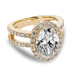 Celebrity inspired diamond accented halo engagement ring with 2.89ct oval cut lab grown diamond center stone set in 18k yellow gold