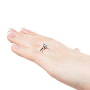 Diamond accented split shank engagement ring with 1ct round cut lab grown diamond set in 14k white gold worn on hand sideview