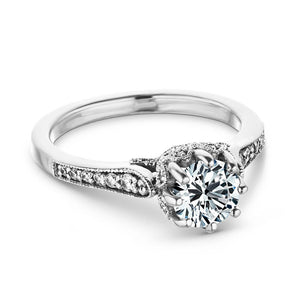 Antique style diamond accented engagement ring with an 8 prong crown style head holding 1ct round cut lab grown diamond with filigree and milgrain detailing in 14k white gold