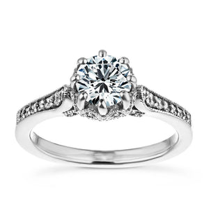 Vintage style diamond accented engagement ring with an 8 prong crown style head holding 1ct round cut lab grown diamond with filigree and milgrain detailing in 14k white gold