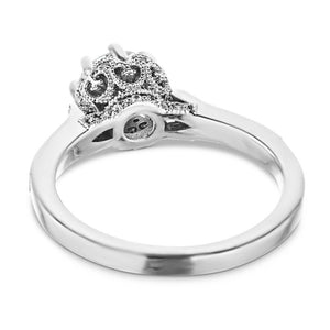 Antique style diamond accented engagement ring with an 8 prong crown style head holding 1ct round cut lab grown diamond with filigree and milgrain detailing in 14k white gold shown from back