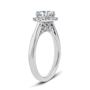 shown with a 1 carat round cut lab grown diamond center stone with an accented lab grown diamond halo set in 14k white gold metal