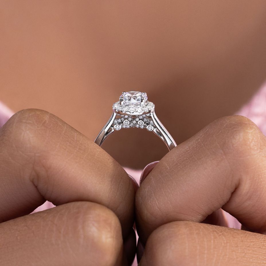 Shown here with a 1.0ct Round Cut Center Stone in 14K White Gold|shown with a 1 carat round cut lab grown diamond center stone with an accented lab grown diamond halo set in 14k white gold metal
