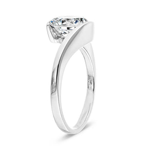 Modern engagement ring with a 2ct round cut lab grown diamond in a 14k white gold band that gives the illusion of a tension setting shown from side