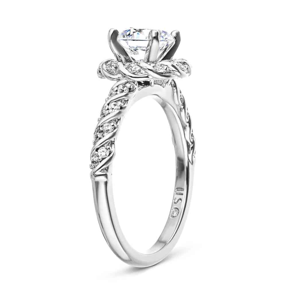 Shown with 1ct Round Cut Lab Grown Diamond in 14k White Gold|Unique twisted diamond halo engagement ring with a 1ct round cut lab grown diamond in a braided design 14k white gold metal band