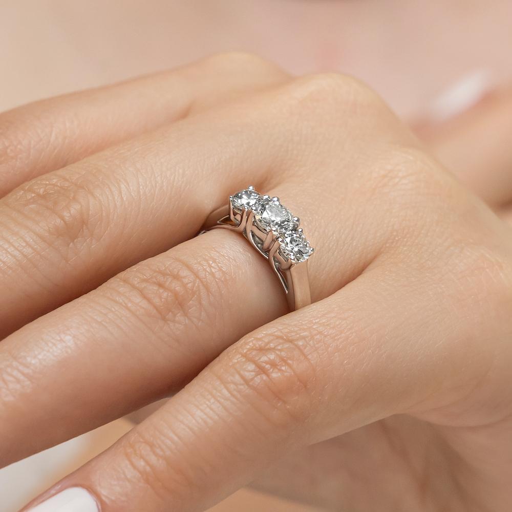 Shown with Three Round Cut Lab Grown Diamonds in 14k White Gold|Elegant three stone engagement ring with round cut lab grown diamonds in 14k white gold