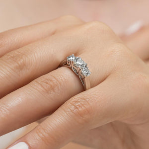 Beautiful three stone engagement ring with round cut lab grown diamonds in 14k white gold shown worn on hand