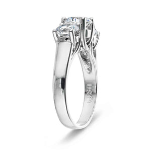 Three stone engagement ring with round cut lab grown diamonds in 14k white gold shown from side