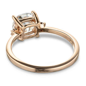 Engagement ring with 1ct cushion cut lab grown diamond with two diamond side stones in 14k rose gold shown from back