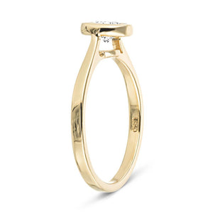 Modern engagement ring with 1ct round cut bezel set lab grown diamond in 14k yellow gold shown from side