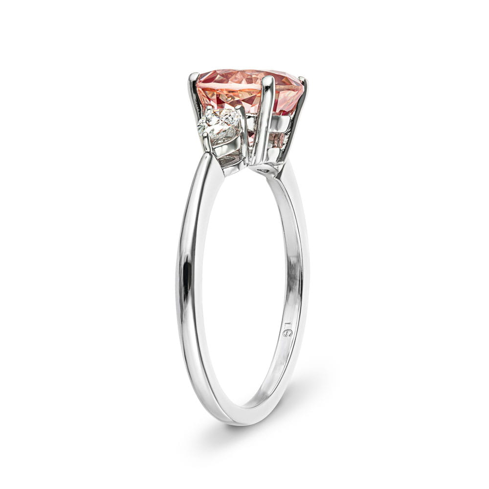 Shown with 2ct Lab Grown Champagne Pink Sapphire in 14k White Gold|Beautiful lab grown champagne pink sapphire engagement ring with pear cut side stones in 14k white gold