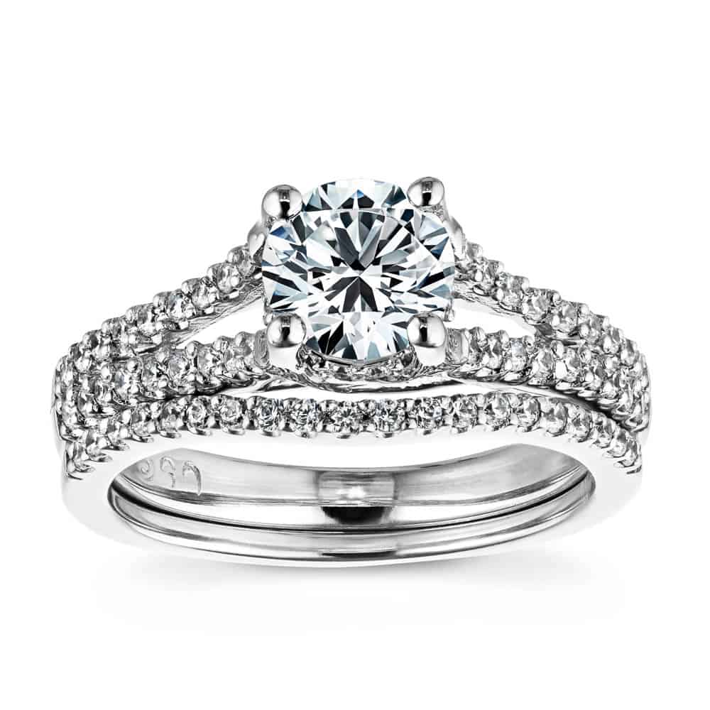 Shown with a 1.0ct Round cut Lab-Grown Diamond with diamond accented split shank and matching wedding band in recycled 14K white gold 