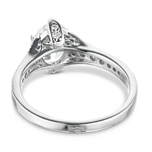 Antique style diamond accented engagement ring with 1ct oval cut lab grown diamond in a milgrain detailed 14k white gold band shown from back
