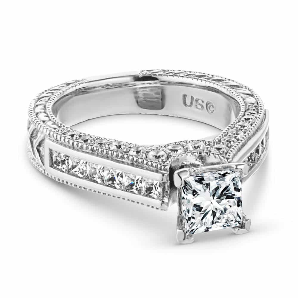 Shown with 1ct Princess Cut Lab Grown Diamond in 14k White Gold|Antique style engagement ring with 1ct princess cut lab grown diamond set in filigree detailed band with channel set accented diamonds in 14k white gold