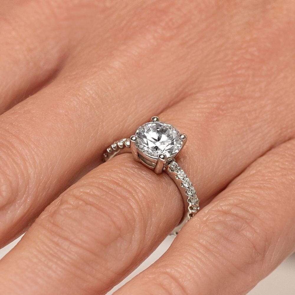 Shown with 1.5ct Round Cut Lab Grown Diamond in Platinum|Beautiful pave set diamond accented engagement ring with 1.5ct round cut lab grown diamond in platinum setting