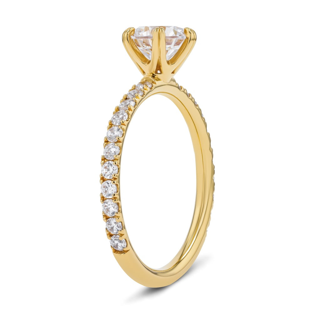 Shown here with a 1.0ct Round Cut Lab Grown Diamond center stone in 14K Yellow Gold|diamond accented 6 prong head engagement ring with round cut lab grown diamond center stone set in 14k yellow gold recycled metal