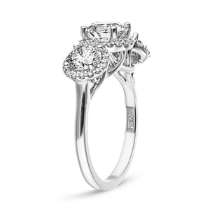 Three stone diamond halo engagement ring with round cut lab grown diamonds in 14k white gold shown from side